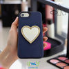 Wireless City heart-shaped stick-on mirror with rhinestone border on a navy phone case. Perfect for makeup touch-ups.